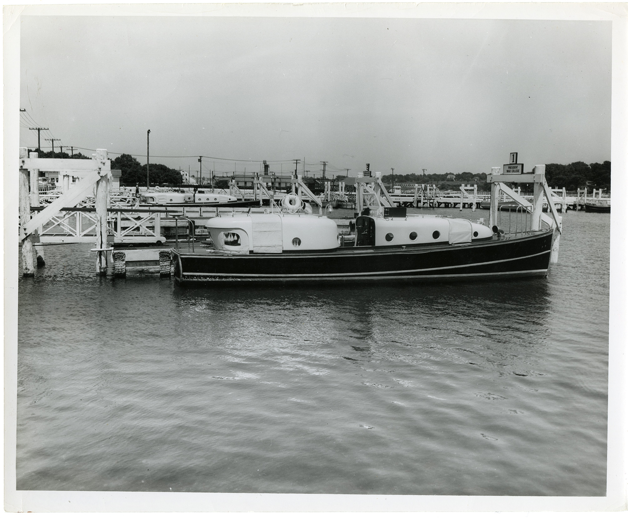 Photograph of the admiral&#39;s barge docked at Naval Station Newport