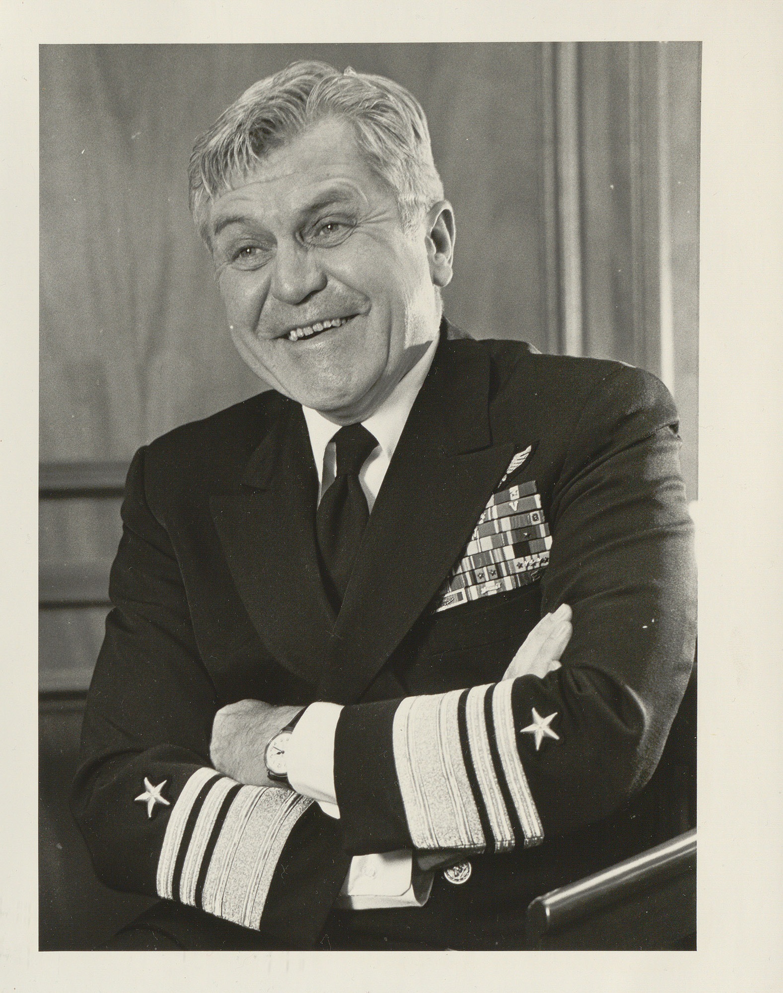 Portrait of VADM Stockdale laughing with arms crossed